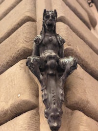 a gargoyle on the side of a building