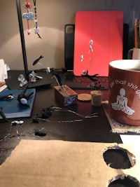 a desk with a cup of coffee on it