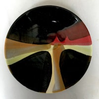 a plate with a black, yellow, and red design