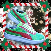 a pair of green and red puma sneakers with christmas decorations