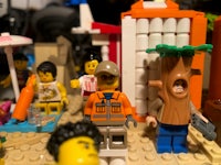 a group of lego people on a beach