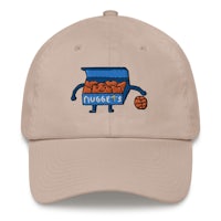 a tan hat with a cartoon character holding a basketball