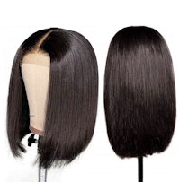 a mannequin with two black wigs on it