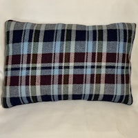 a blue and green plaid pillow on a white background