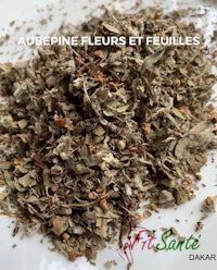 a mixture of dried herbs on a white plate