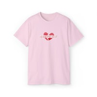 a pink t - shirt with a heart on it