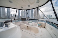 the interior of a white boat with a view of a city
