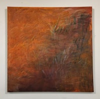 a painting of an orange and brown painting on a wall