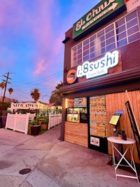 an image of a sushi restaurant at dusk