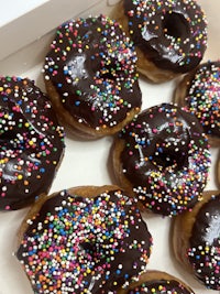 donuts in a box with sprinkles