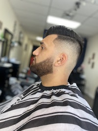 a man with a beard in a barber shop