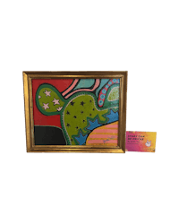 a framed painting of a cactus in a gold frame