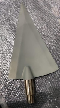 a metal triangle on a piece of cloth
