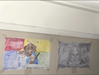 a group of drawings on the wall of a room