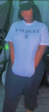a woman wearing a t - shirt that says energize e