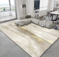a modern living room with a beige and yellow rug
