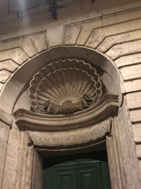 the entrance to a building with an ornate door