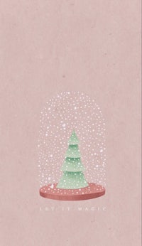 a snow globe with a christmas tree in it