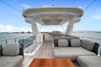 the interior of a boat with couches and a sofa