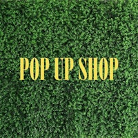 a green grass background with the words pop up shop