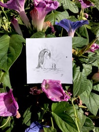 a drawing of a penguin sitting on a flower