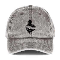 a gray dad hat with an image of a man holding a gun