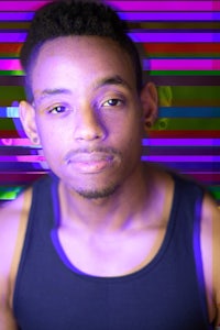 a man in a black tank top