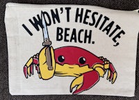 a bag that says i won't hesitate beach