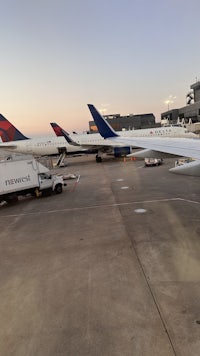 the planes are parked on the tarmac