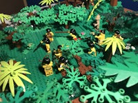 a lego model of a jungle with people in it