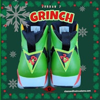 a pair of green and white sneakers with the word grinch on them