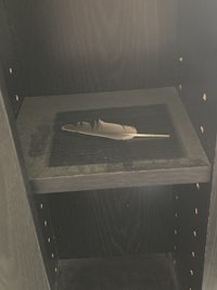 a black box with a knife in it