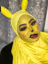 a woman in a yellow pikachu costume