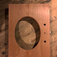 a wooden box with a hole in it