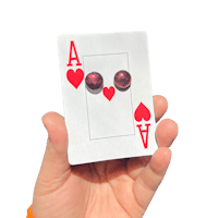 a person holding up a playing card with red hearts on it