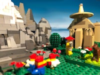 an image of a lego scene with a castle in the background