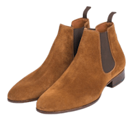 a pair of brown sued chelsea boots