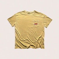 a yellow t - shirt with a red logo on it