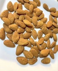 almonds on a white plate on a table