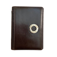 a brown leather wallet with a gold ring on it