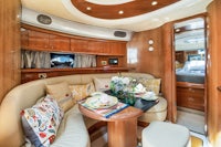 the interior of a motor yacht with couches and a television