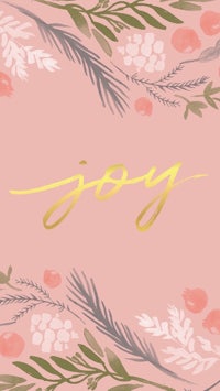 a pink card with the word joy in gold lettering