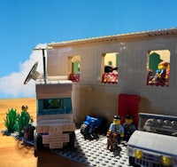 a lego house with people and a car on a table