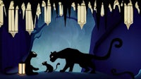 a black panther and a cat in a cave