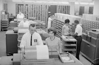 Employees working in the computer section of the Patent Office in the Commerce Building, Washington, D.C.
