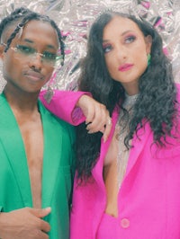 a woman in a green suit and a man in a pink suit