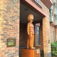 a statue of a soldier in front of a building