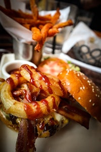 a burger with bacon and bbq sauce