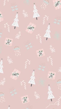 a pink christmas pattern with christmas trees and candy canes
