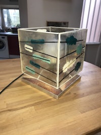 a glass box sitting on top of a table